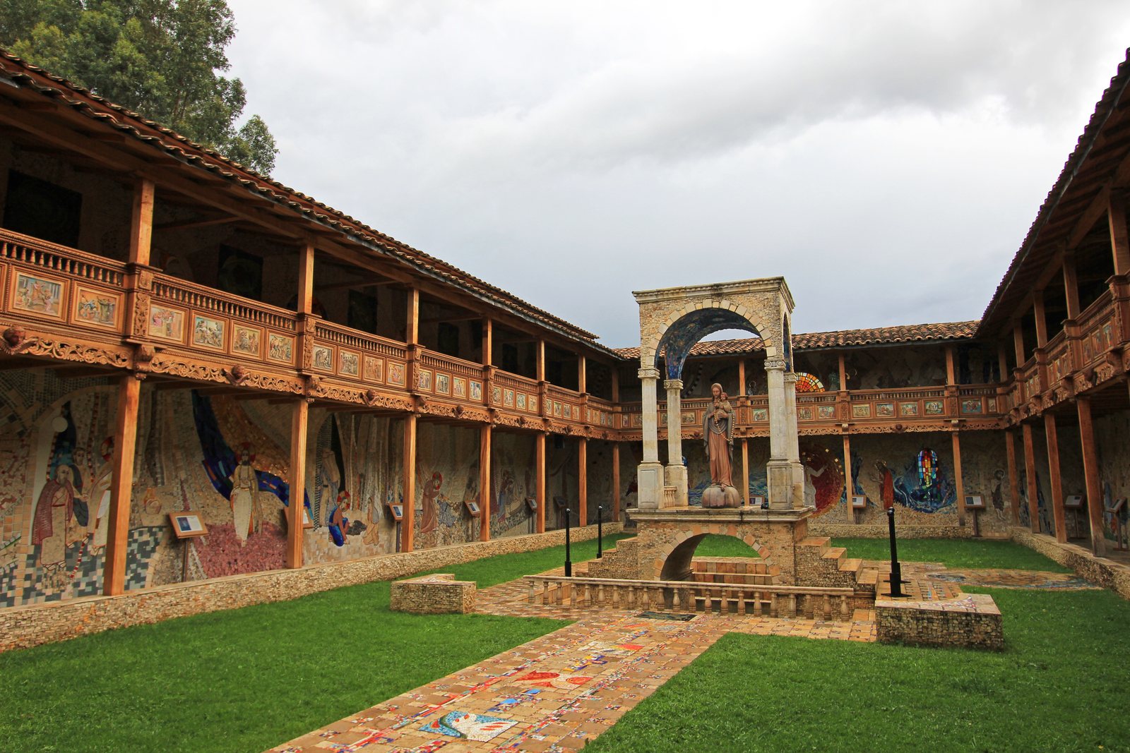 The courtyard at Polloc, every wall, column and arch covered in coloured mosaic tile