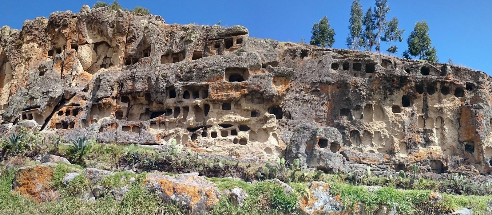 Burial niches cut into the cliff at Ventanillas de Otuzco