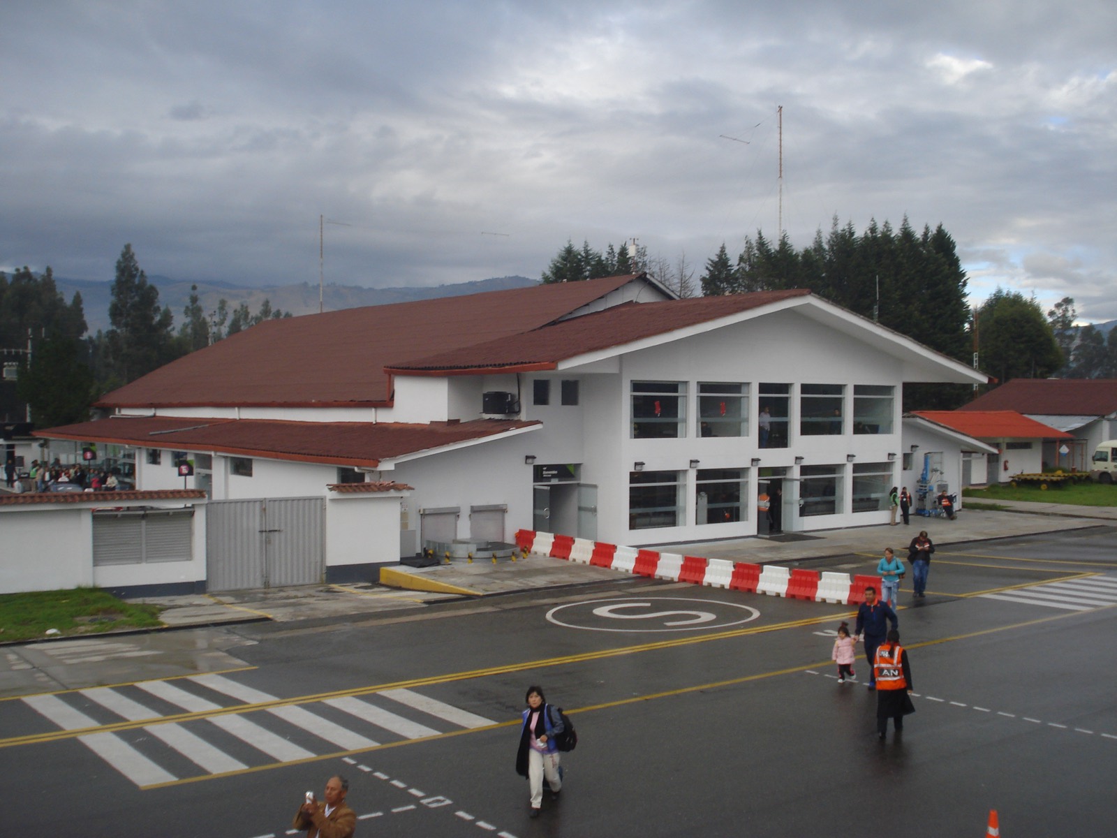 The terminal building at Cajamarca's airport, seen from the apron with the hills behind it